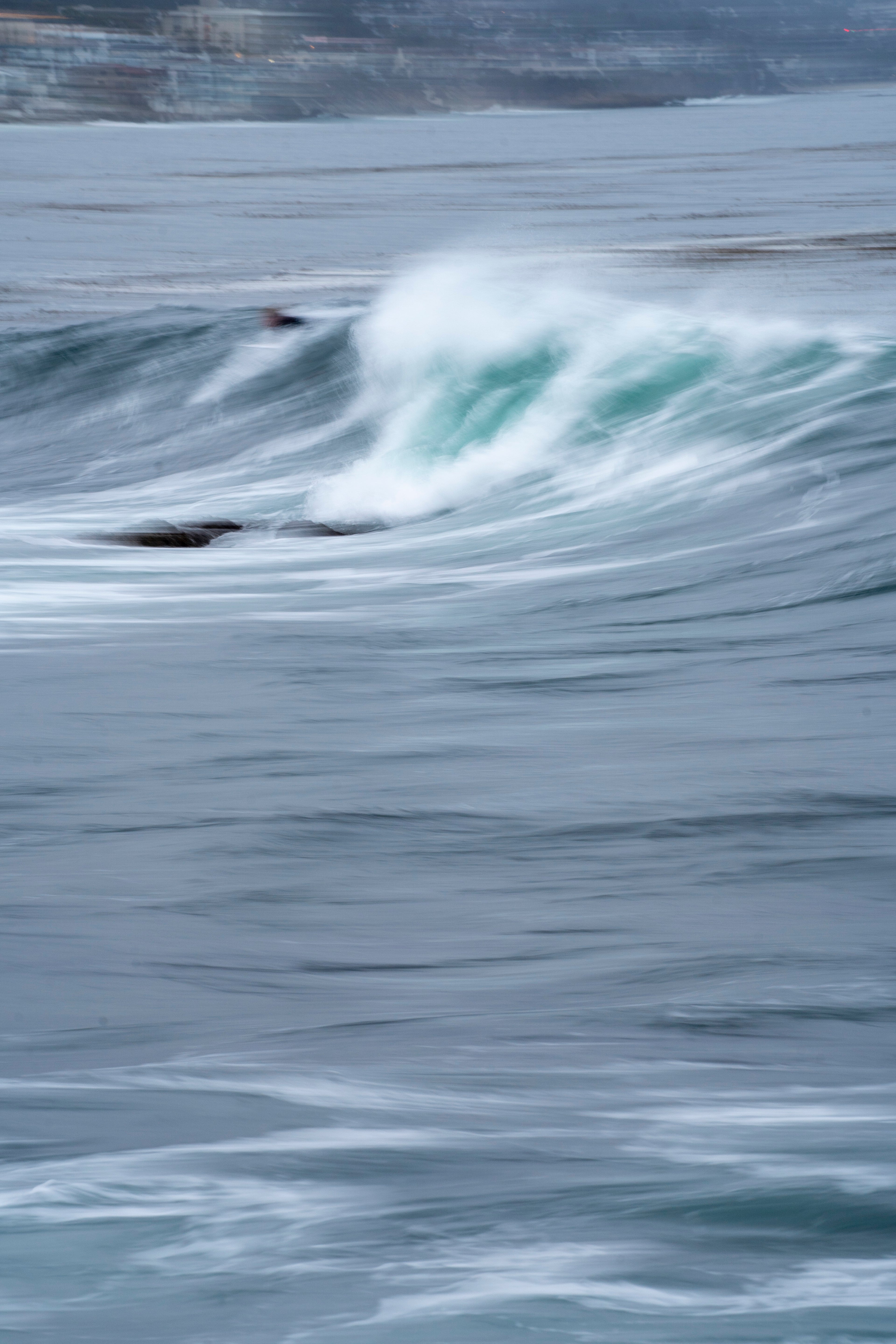 ABSTRACT WAVE WITH SURFER LAGUNA BEACH