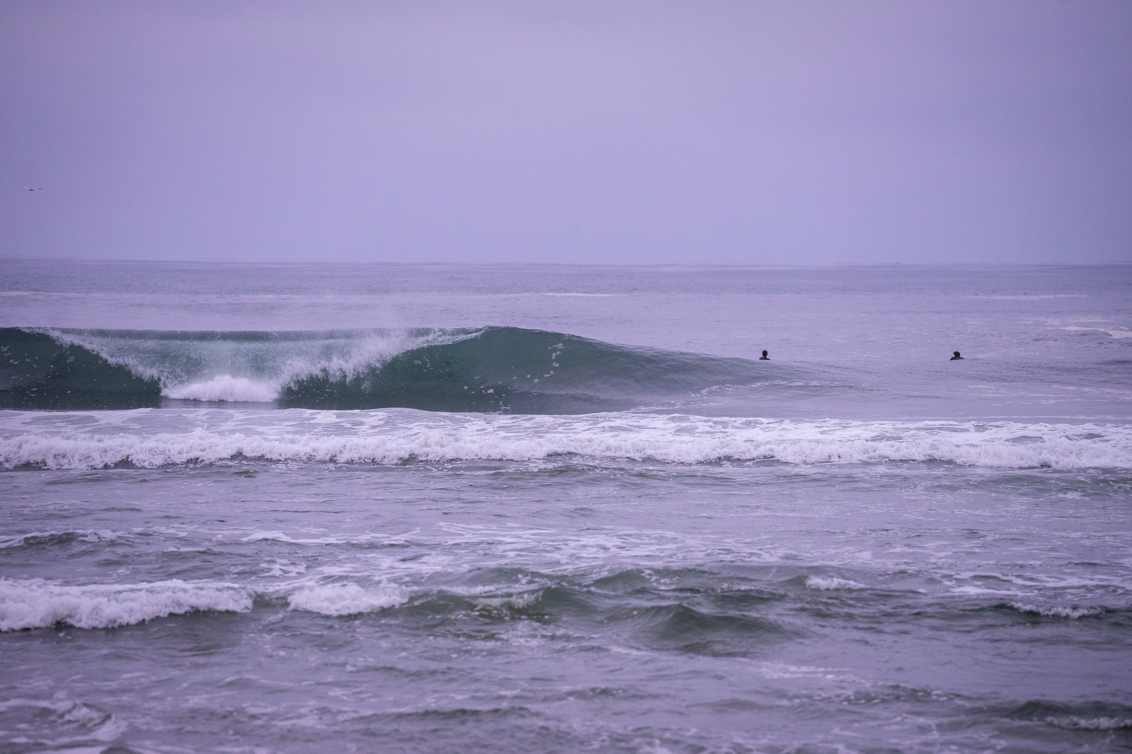 Purple Dawn. Breaking Waves in Newport Beach at Dawn