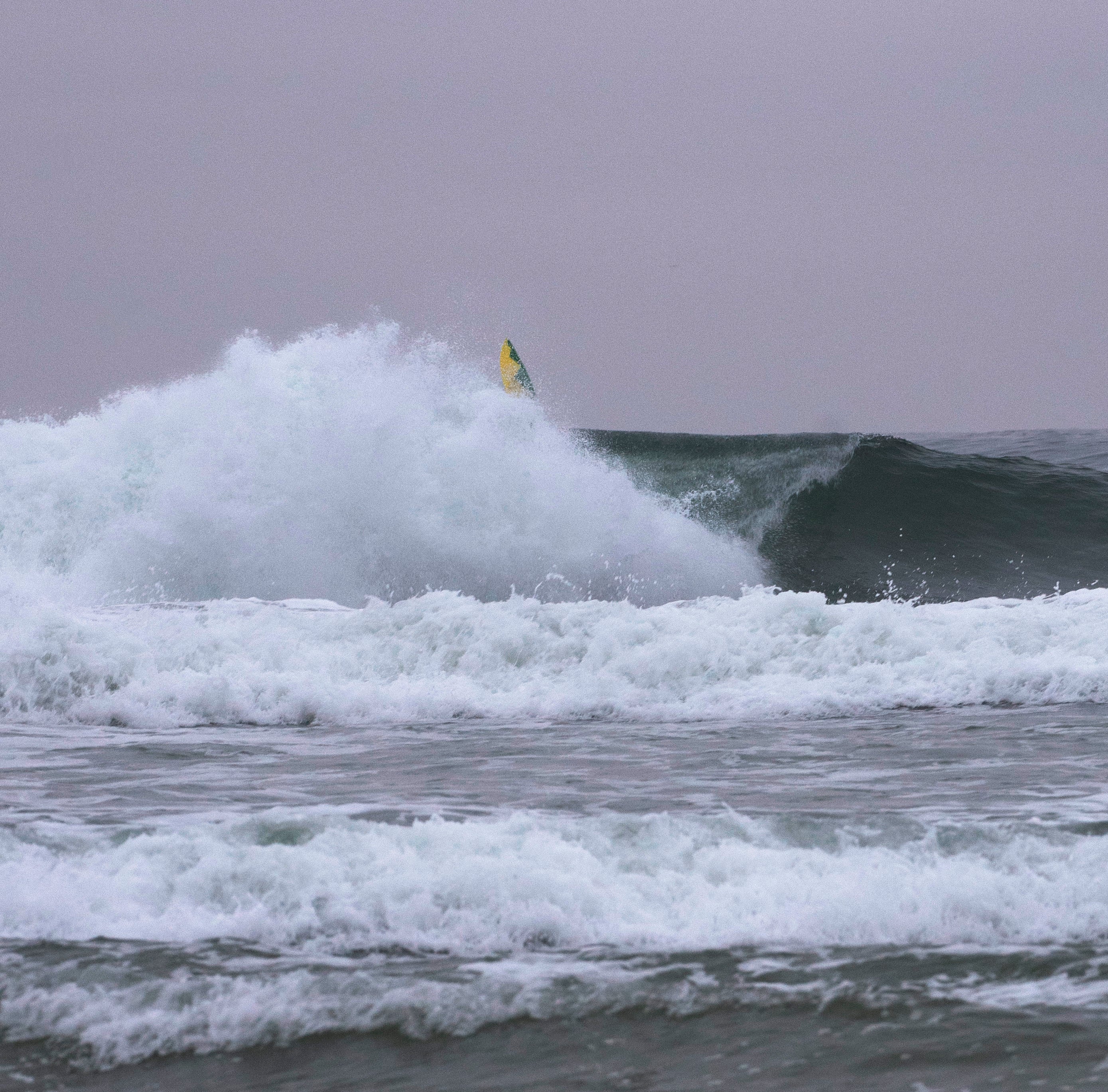 Wave Crashing on a Fallen Surfer in Newport Beach